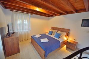 Posteľ alebo postele v izbe v ubytovaní Plokamos House