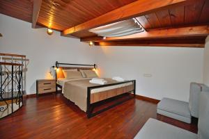 Posteľ alebo postele v izbe v ubytovaní Plokamos House