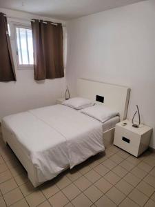 Een bed of bedden in een kamer bij Hello Guyane (7), Grand Appartement Prestigieux F3