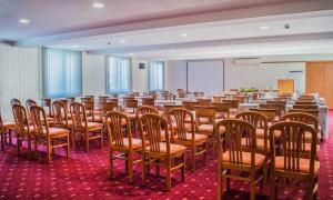 a large room with a bunch of chairs in it at Spa Hotel Dvoretsa in Velingrad +77 photos