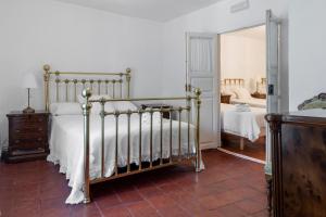 Ένα ή περισσότερα κρεβάτια σε δωμάτιο στο Albergue LaMorena