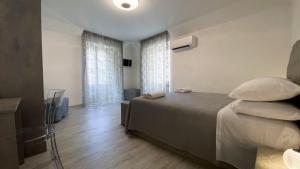 Postel nebo postele na pokoji v ubytování Palazzo Framì