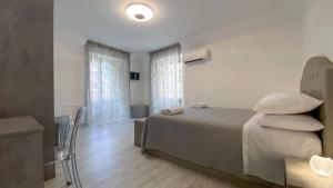 Postel nebo postele na pokoji v ubytování Palazzo Framì
