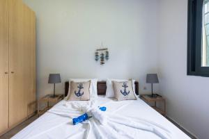 Postel nebo postele na pokoji v ubytování Psi·Theros