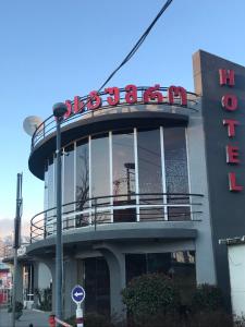 a building with a sign on top of it at Hotel ERA in Tbilisi City