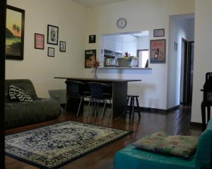 a living room with a couch and a table at Pousadinha Copacabana in Rio de Janeiro