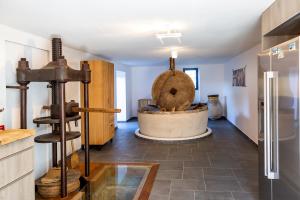 a kitchen with a bath tub in the middle of a room at Le moulin de Figari, nouvelle climatisation in Figari