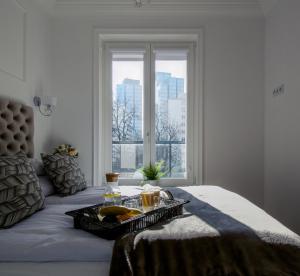 Posteľ alebo postele v izbe v ubytovaní Warsaw Seasons by Alluxe Boutique Apartments