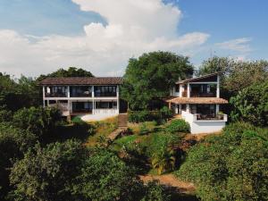 a house on top of a hill with trees at Little Tamarind in Tangalle