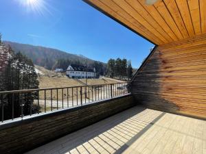 a view from the balcony of a house at JZ Apartments - Pohorje in Maribor