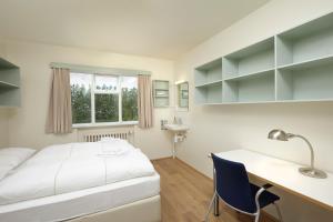 Ένα ή περισσότερα κρεβάτια σε δωμάτιο στο Hotel Edda Akureyri