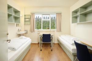 Ένα ή περισσότερα κρεβάτια σε δωμάτιο στο Hotel Edda Akureyri