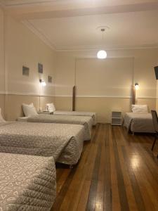 En eller flere senger på et rom på Los Andes Bed & Breakfast