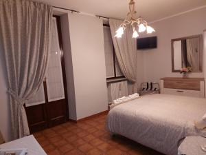 Giường trong phòng chung tại Casa dell'Agrifoglio