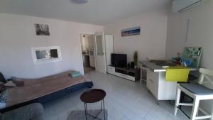 Televízia a/alebo spoločenská miestnosť v ubytovaní Onix -Orfű Aqua Apartman