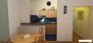 Kuchyň nebo kuchyňský kout v ubytování Floriańska NewTown