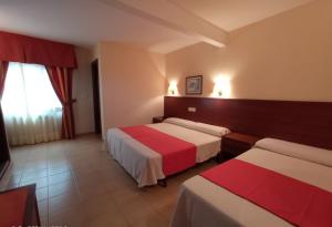 Cama o camas de una habitación en Hotel Siroco