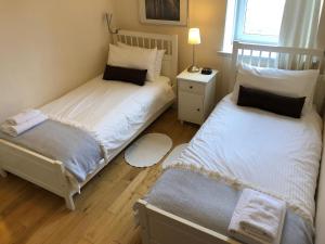 Ένα ή περισσότερα κρεβάτια σε δωμάτιο στο Oakbank - Comfort in the Glens!