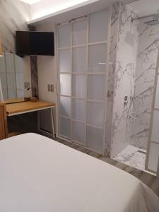 Postel nebo postele na pokoji v ubytování Sroom Apartment