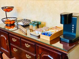 a table with a coffee maker on top of it at Terrell House B&B in Burnsville