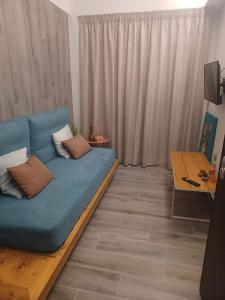 TV a/nebo společenská místnost v ubytování Sroom Apartment