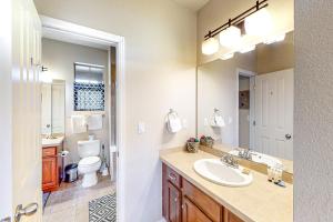 a bathroom with a sink and a toilet and a mirror at Summit Point Place in Granby +41 photos