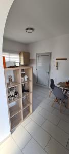 a kitchen with a table and a chair in a room at Lovely 1betroom apartment near the beach in Pyla