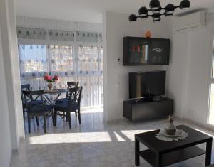 A television and/or entertainment centre at IRiS DEL MAR