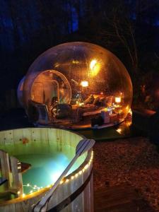 a large bubble house with a swimming pool in it at Bubble-Tent Elzach inklusive Hot Tube Badefass in Elzach