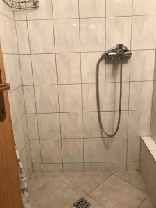 a shower with a hose in a bathroom at Splitska Oaza in Split