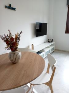 Televízia a/alebo spoločenská miestnosť v ubytovaní IJD apartments 119 PARKING GRATIS Y PISCINA