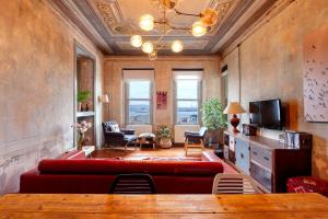 a living room with a couch and a table at Origine Rentals Galata Tower in Istanbul