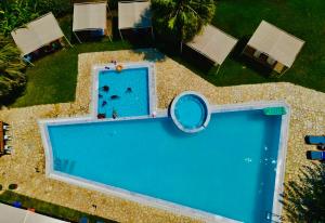 an overhead view of a swimming pool at Glyfa Beach Hotel in Vartholomio