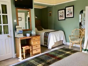 Ένα ή περισσότερα κρεβάτια σε δωμάτιο στο Buttermilk Lodge Guest Accommodation