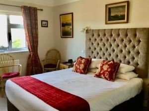Ένα ή περισσότερα κρεβάτια σε δωμάτιο στο Buttermilk Lodge Guest Accommodation