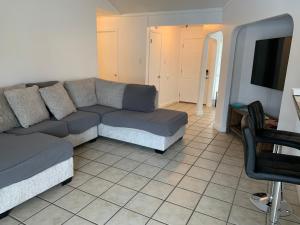 a living room with a couch and a tv at Cheerful 3-bedroom with a pool in San Antonio