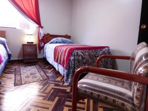 Posteľ alebo postele v izbe v ubytovaní Hostal los Uros