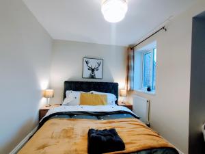 a bedroom with a large bed and a window at Crystal Suite 2 -free private parking in North Shields
