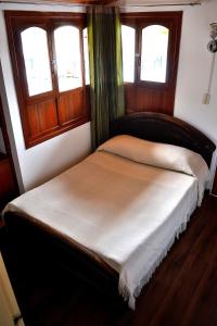 Łóżko lub łóżka w pokoju w obiekcie Hotel Itzamana
