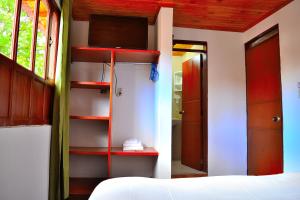 Łóżko lub łóżka w pokoju w obiekcie Hotel Itzamana