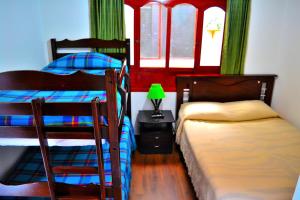 Łóżko lub łóżka w pokoju w obiekcie Hotel Itzamana
