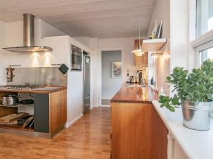 a kitchen with a sink and a counter top at Holiday home Skagen LXI in Skagen