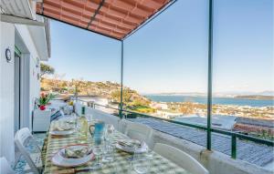 a dining table with a view of the ocean at 2 Bedroom Nice Apartment In Ischia in Ischia
