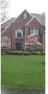 a large brick house with a green lawn in front of it at Comfortable, spacious, 1bdrm basement apartment, sleeps 4 in Milton