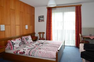 Postel nebo postele na pokoji v ubytování Haus Dachstein Schnitzer
