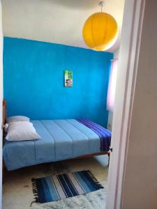 En eller flere senge i et værelse på Casa Cielo