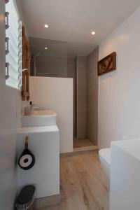 a white bathroom with a sink and a toilet at Brand new Javea apartment 50m from Arenal beach in Jávea +26 photos