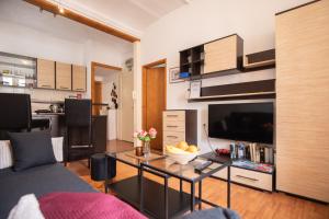 a living room with a couch and a table at Apartment Mari in Dubrovnik