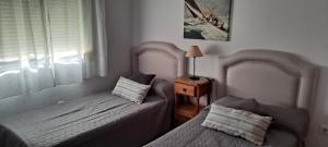 Posteľ alebo postele v izbe v ubytovaní UNIFAMILIAR 3 D.NOVO SANCTI PETRI