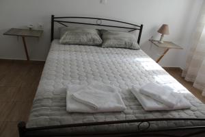 A bed or beds in a room at HAROULENA